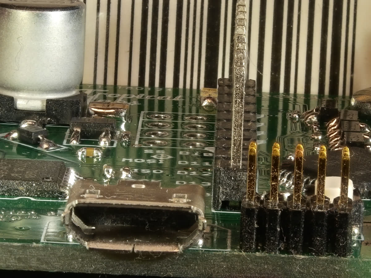 The same seven frames stacked by this page: pins, socket, capacitor and the board's silkscreen are all sharp.